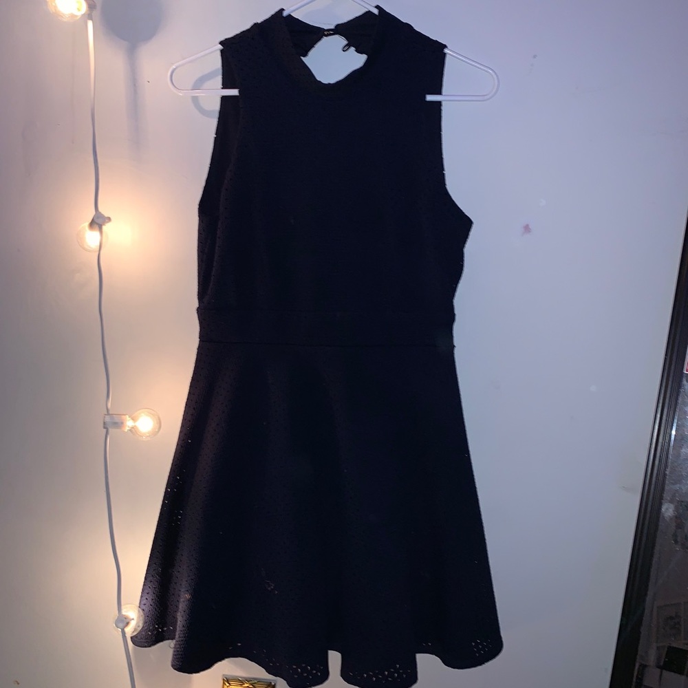 A short navy blue backless dress